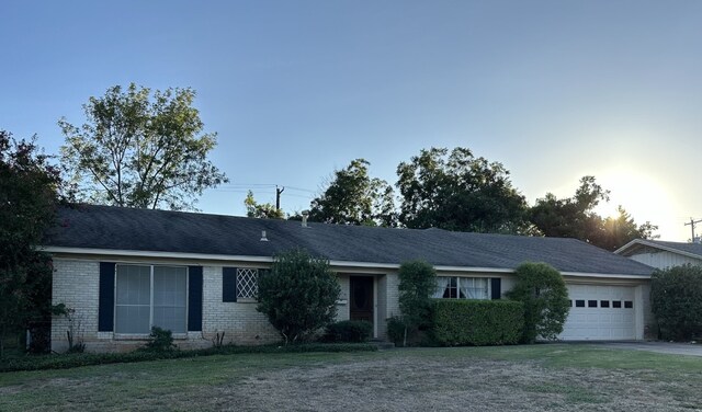 single story home with a garage