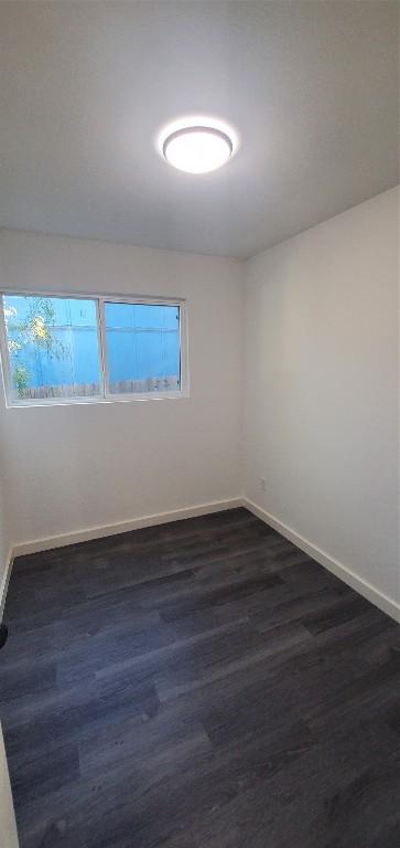 spare room featuring hardwood / wood-style flooring