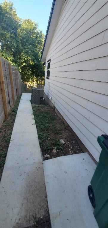 view of home's exterior with fence