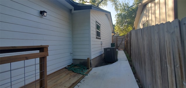 view of side of home with central AC