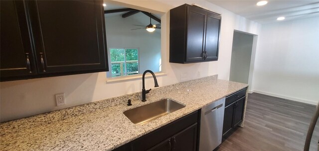 kitchen featuring light stone counters, stainless steel dishwasher, ceiling fan, dark hardwood / wood-style floors, and sink