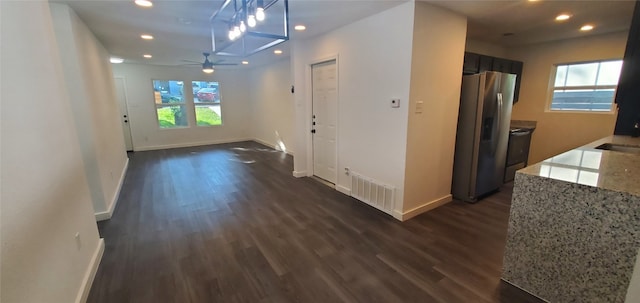 hall with dark wood-type flooring and sink