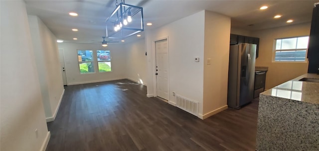 hallway featuring dark wood-type flooring and sink