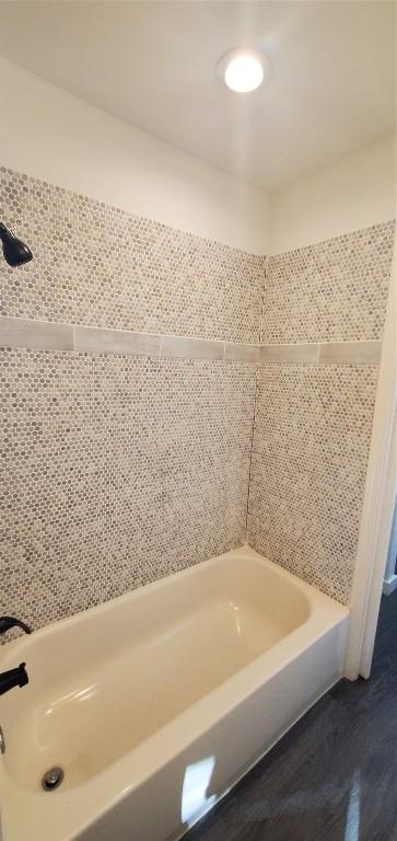 full bath featuring a washtub and wood finished floors