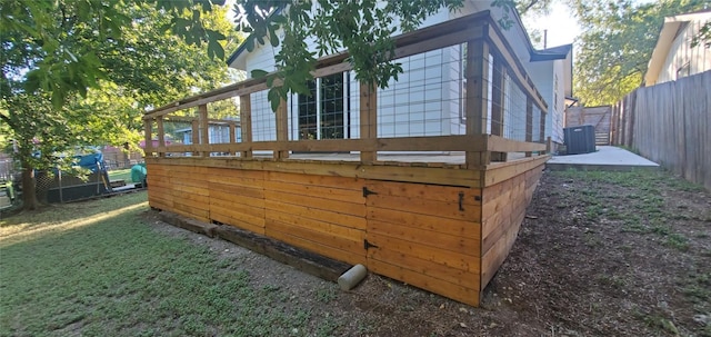 view of side of home featuring a fenced backyard and cooling unit