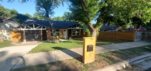 view of front facade with a garage and a front yard