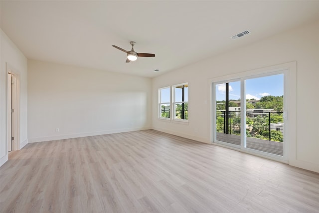 spare room featuring light hardwood / wood-style floors and ceiling fan