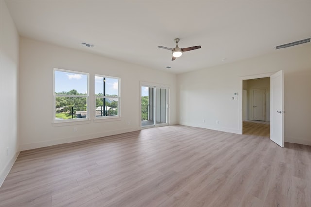 empty room featuring ceiling fan and light hardwood / wood-style floors