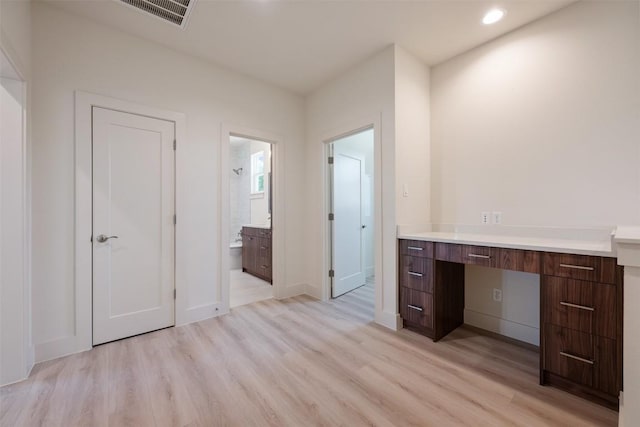 2646 Crazyhorse Pass, Austin, TX 78734 - interior space featuring light wood-style flooring, ensuite bathroom, baseboards, visible vents, and recessed lighting