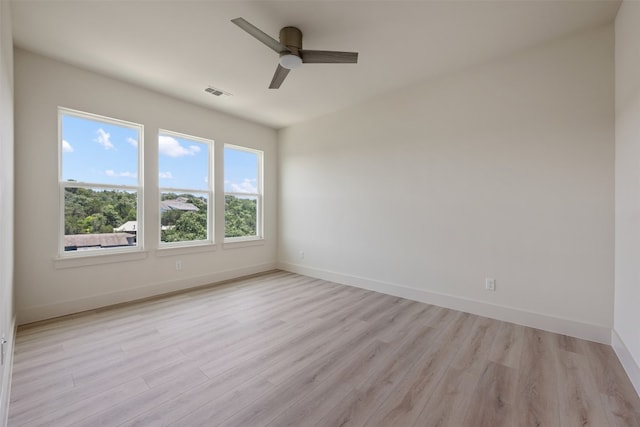 unfurnished room featuring ceiling fan and light hardwood / wood-style flooring