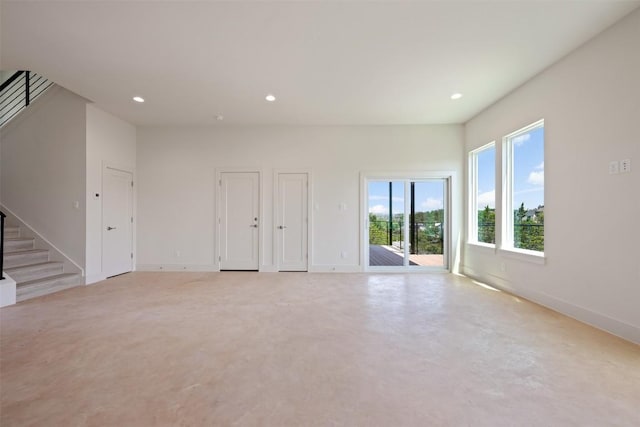 2646 Crazyhorse Pass, Austin, TX 78734 - unfurnished room with finished concrete flooring, stairs, baseboards, and recessed lighting