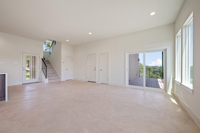 2646 Crazyhorse Pass, Austin, TX 78734 - unfurnished living room featuring baseboards, stairs, and recessed lighting