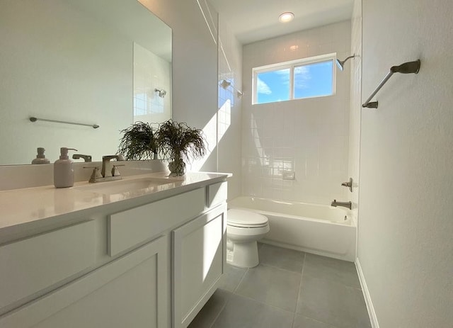 full bathroom with tile patterned floors, vanity, toilet, and tiled shower / bath combo