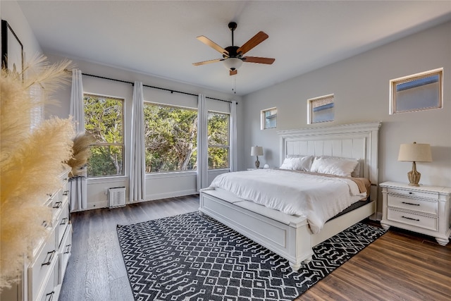 bedroom with dark wood-type flooring and ceiling fan