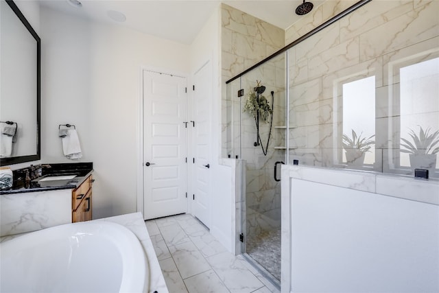 bathroom featuring vanity and separate shower and tub