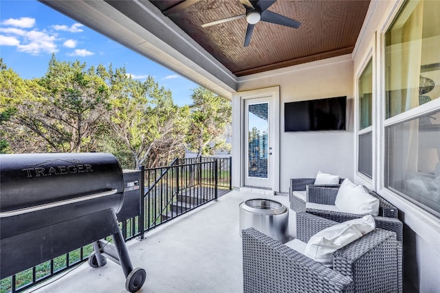 balcony with ceiling fan and a grill