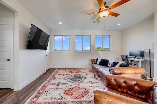 living room with ceiling fan and dark hardwood / wood-style floors