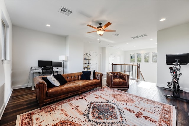 living room with dark hardwood / wood-style floors and ceiling fan