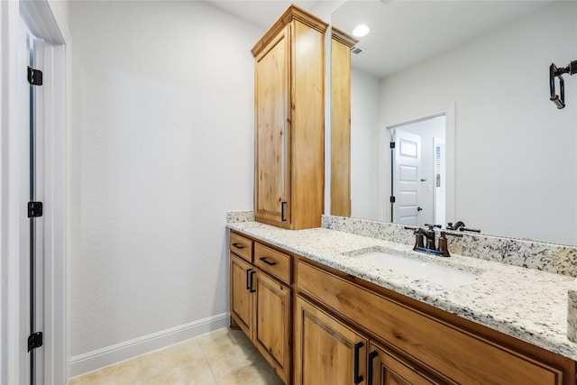 bathroom with tile patterned flooring and vanity