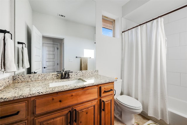 full bathroom featuring shower / bath combo, vanity, and toilet