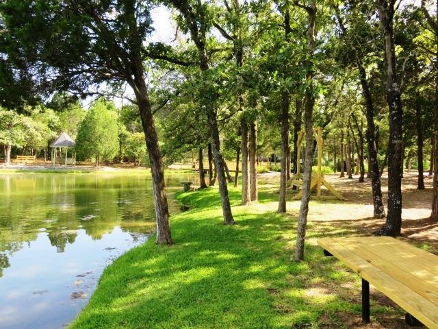 view of property's community with a water view and a gazebo