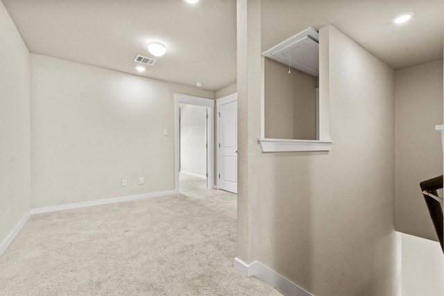 hallway featuring light carpet