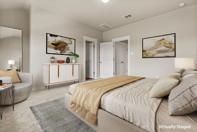 bedroom featuring carpet and lofted ceiling