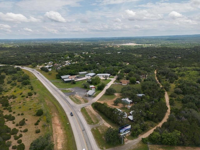 aerial view featuring a wooded view