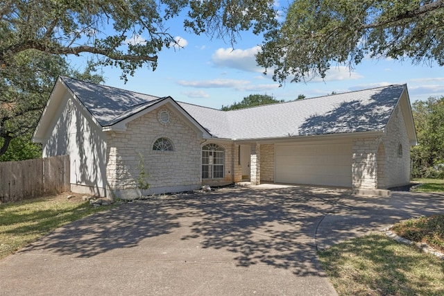 ranch-style home featuring a garage