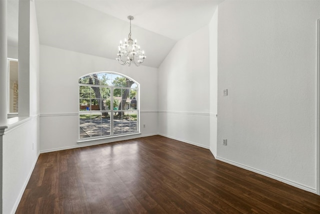 unfurnished room with vaulted ceiling, an inviting chandelier, and wood-type flooring