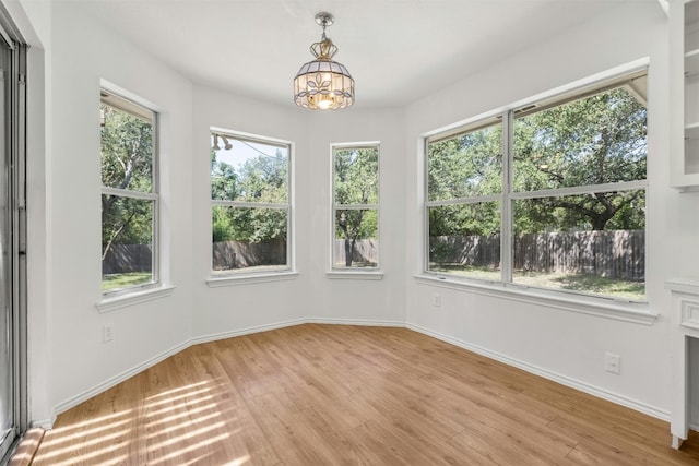 interior space featuring a chandelier and light wood-type flooring