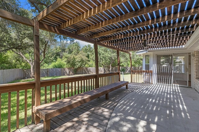 wooden terrace featuring a pergola and a yard