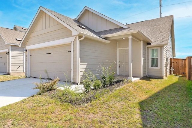 view of front facade with a front yard and a garage