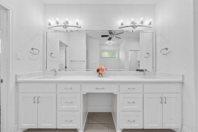 bathroom with dual vanity and tile patterned floors