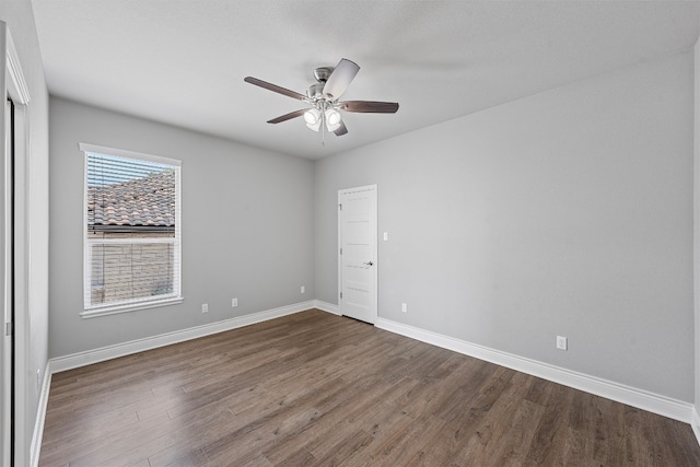 spare room featuring hardwood / wood-style flooring and ceiling fan