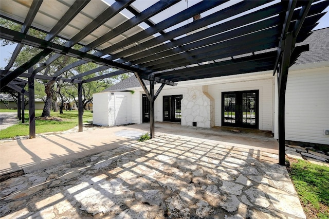 view of patio / terrace with french doors, a shed, and a pergola