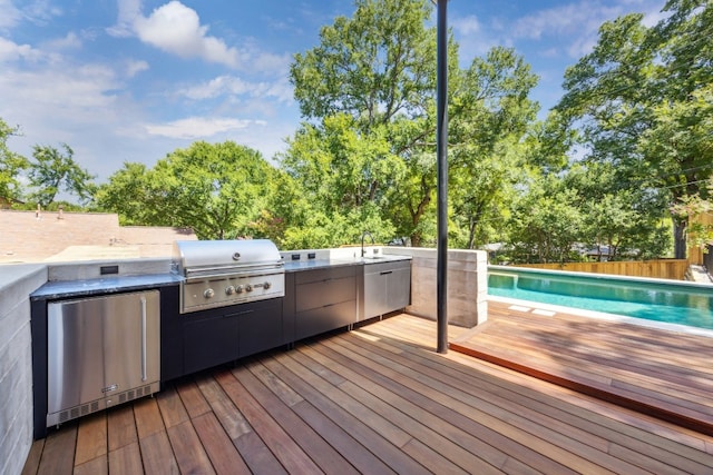 3003 Oakhaven Dr, Austin, TX 78704 - deck with grilling area, area for grilling, a sink, and fence