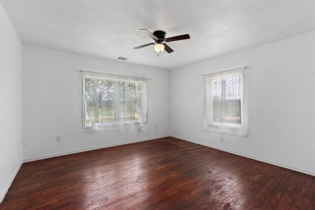 unfurnished room featuring dark hardwood / wood-style floors, a textured ceiling, and ceiling fan