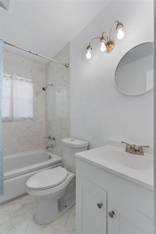 full bathroom with vanity, shower / bath combination with curtain, and toilet