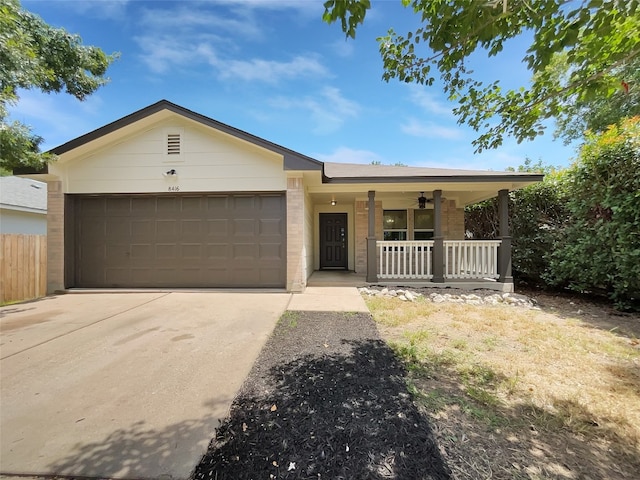 ranch-style home featuring a garage and a porch