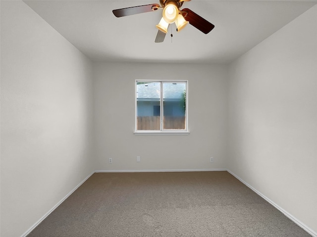 empty room featuring carpet floors and ceiling fan