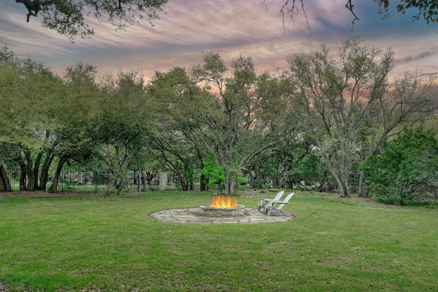 yard at dusk with a fire pit