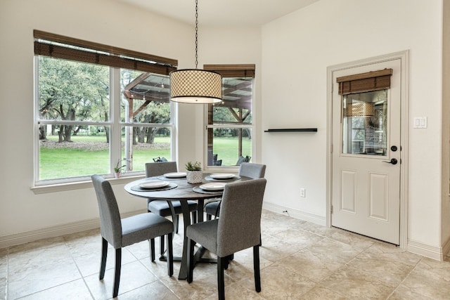 dining area with light tile patterned flooring