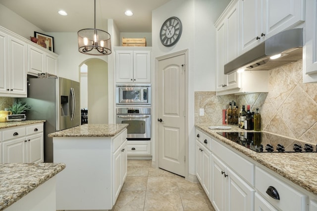 kitchen featuring tasteful backsplash, stainless steel appliances, decorative light fixtures, light tile patterned floors, and white cabinetry