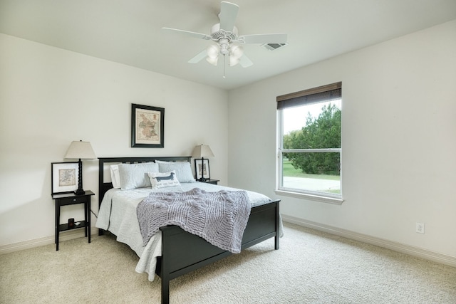 bedroom with light carpet and ceiling fan