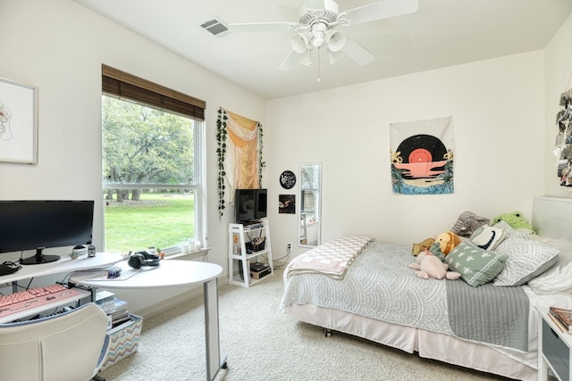 carpeted bedroom featuring ceiling fan