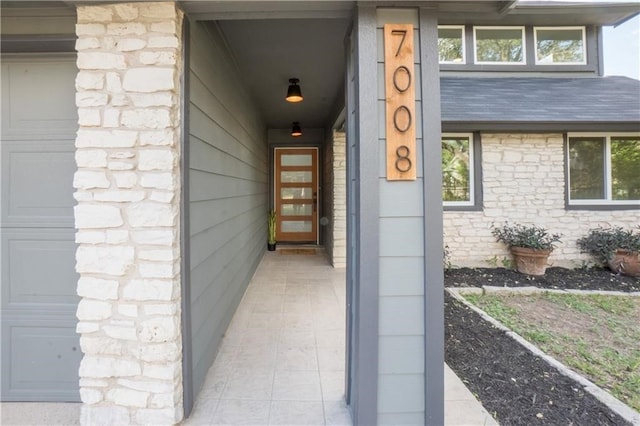 doorway to property featuring a garage