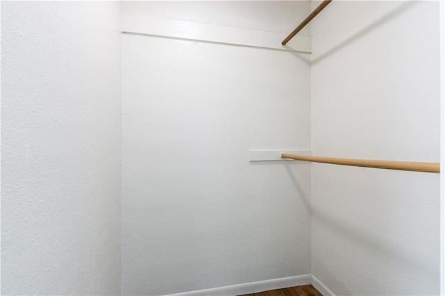 spacious closet with wood finished floors