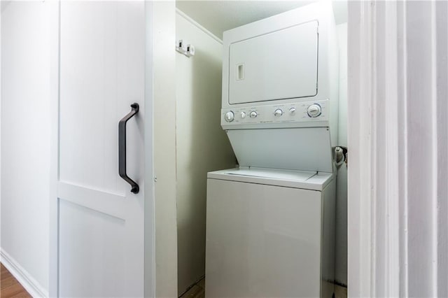 laundry area with laundry area and stacked washing maching and dryer