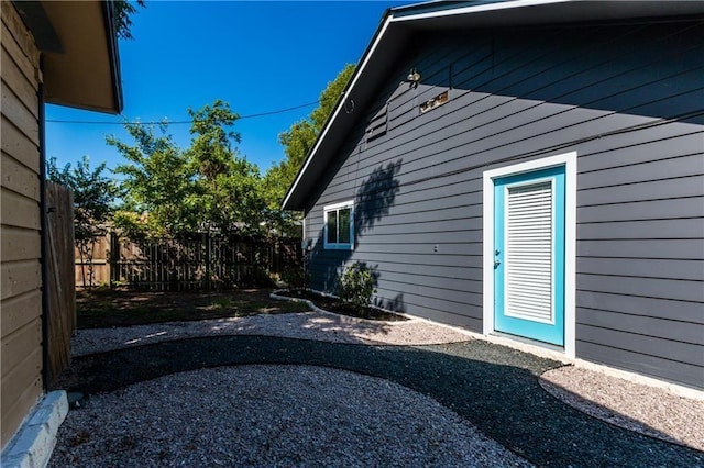 view of home's exterior featuring fence